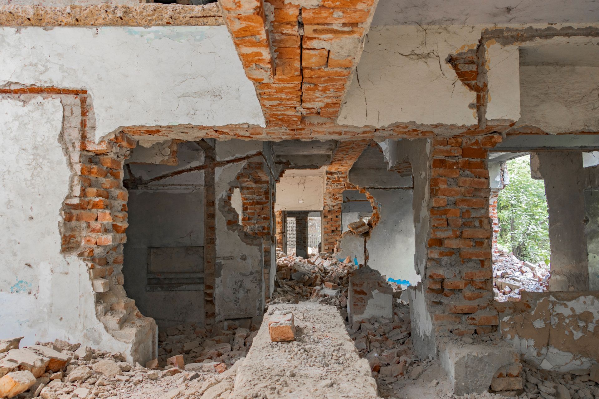Explore the decaying ruins of an abandoned building with exposed bricks and destruction.